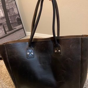 Billy Kirk brown leather tote with red name tag